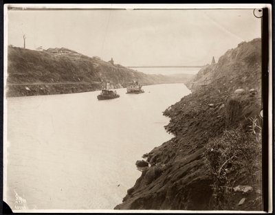 View of Two Boats in the Panama Canal During its Construction with a Suspension Bridge Beyond, 1913 by Byron Company